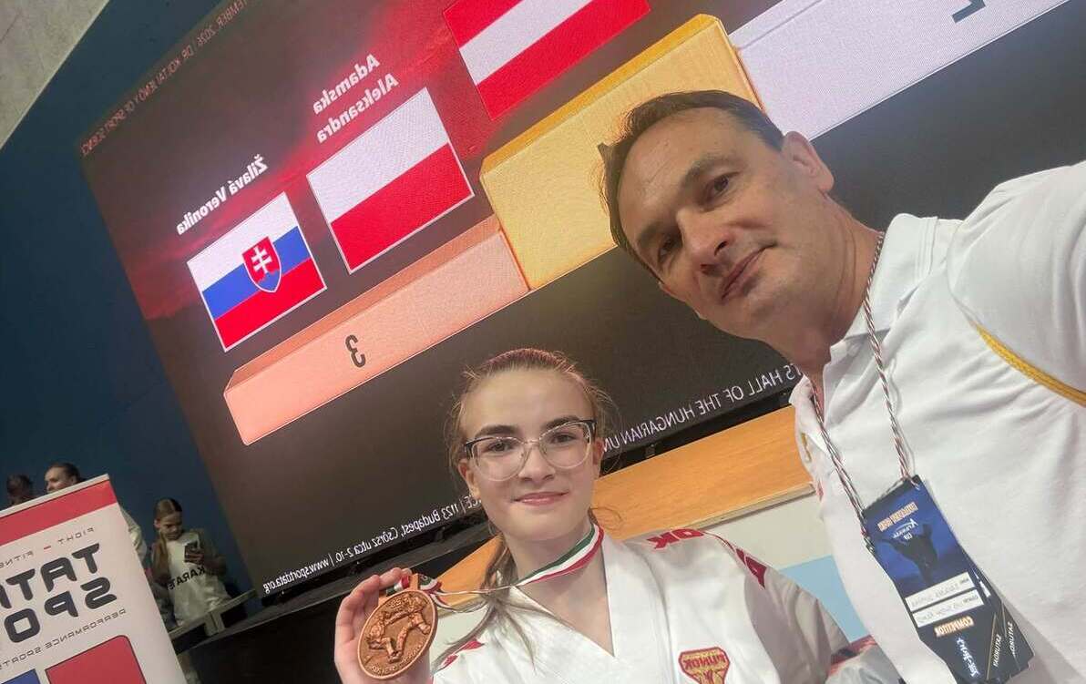 Plakat zwyciężczyni z tremerem.